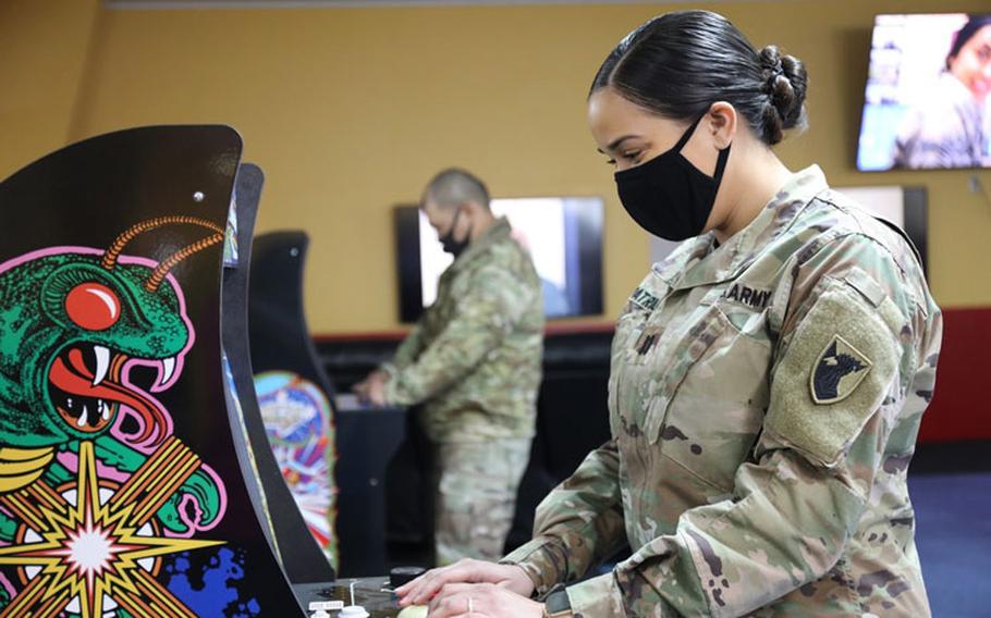 Capt. Ashley Patrick, assigned to the 38th Air Defense Artillery Brigade, plays on a classic arcade cabinet in the Gauntlet Room, a new recreation facility located on Sagami General Depot that was opened to the public following a ribbon-cutting ceremony Feb. 5. (Photo Credit: Noriko Kudo, U.S. Army Garrison Japan Public Affairs)