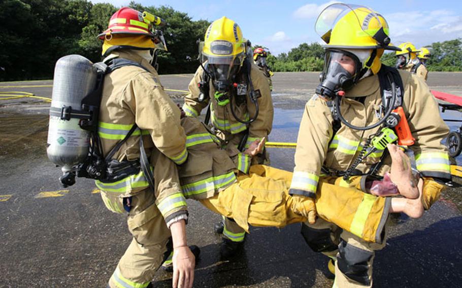 Camp Zama firefighters practice emergency services during a full-scale exercise at Camp Zama Aug. 21, 2018. USAG Japan Fire and Emergency Services is the 2018 Installation Management Command-Pacific Fire Department of the Year -- Large Category. (Photo Credit: Yuichi Imada, U.S. Army Garrison Japan Visual Information)