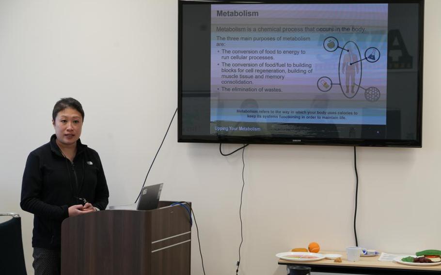 Shannon Vo, Lead Health Educator and Director for the Camp Zama Army Wellness Center, briefs participants during a nutrition course, February 21, 2023. Courses like the health nutrition, pictured above, are among six kinds offered to Department of Defense (DoD) civilians and their families, along with active-duty servicemembers living and working on Camp Zama.