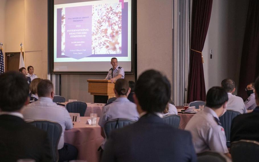 Col. Brad Brough, 374th Medical Group commander, thanks attendees for participating in the 2022 International Healthcare Symposium, April 22, 2022, in the Officer’s Club at Yokota Air Base, Japan. This symposium was the largest bilateral symposium event hosted by the 374th Medical Group, showcasing various clinical case studies from 15 presenters. (U.S. Air Force photo by Senior Airman Hannah Bean)