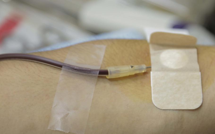 A donor gives blood at Marine Corps Air Station Iwakuni, Japan, March 12, 2019. The American and Japanese Red Cross societies partnered together to host a blood drive in order to gather more donors than by just holding a blood drive on their own. (U.S. Marine Corps photo by Cpl. Stephen Campbell)