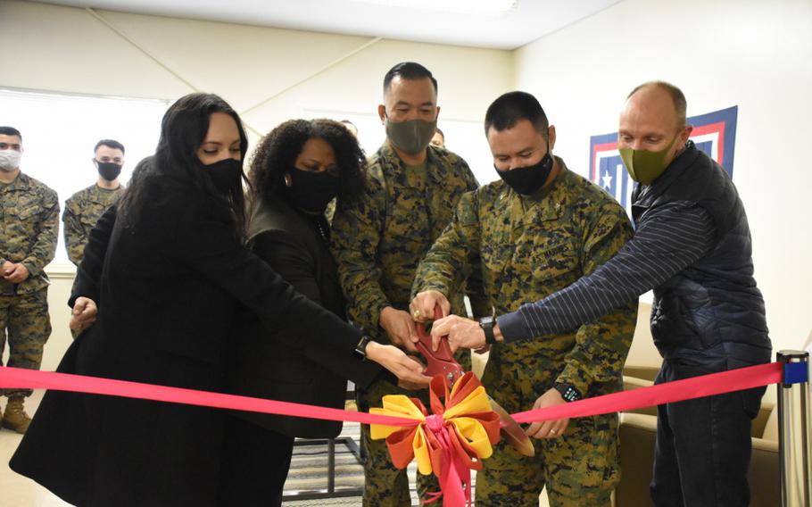 USO Japan and Combined Arms Training Center Camp Fuji leadership cut the ribbon to mark the opening of the USO lounge, CATC Camp Fuji, Japan, Dec. 2, 2020. CATC Camp Fuji provides U.S. Forces the premier training facility in Japan, supports operational plans, and strengthens relationships with Joint and Japanese partners in order to ensure U.S. forward deployed and based forces are ready for contingency operations.