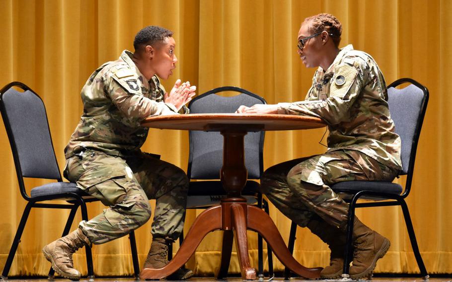 Sgt. Tierra Jenkins, left, assigned to the 901st Military Police Detachment, plays a concerned friend in a skit with Sgt. Kristen Bennett, assigned to the 88th MP Detachment, during a U.S. Army Garrison Japan Army Community Service Family Advocacy Program training about domestic violence awareness at the Camp Zama Community Recreation Center, Japan, Oct. 10, 2019.