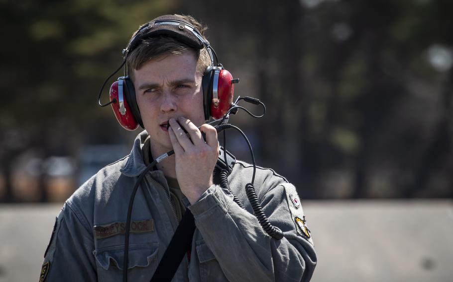 U.S. Air Force Senior Airman Kyle Greyshock, a 13th Fighter Squadron avionics systems journeyman, speaks into a radio headset at Misawa Air Base, Japan, March 30, 2020. Avionics specialists require attention to detail since proper maintenance can mean the difference between mission success and failure. Part of their job consists of helping make quick fixes to jets to ensure they are available for flight. (U.S. Air Force photo by Airman 1st Class China M. Shock)