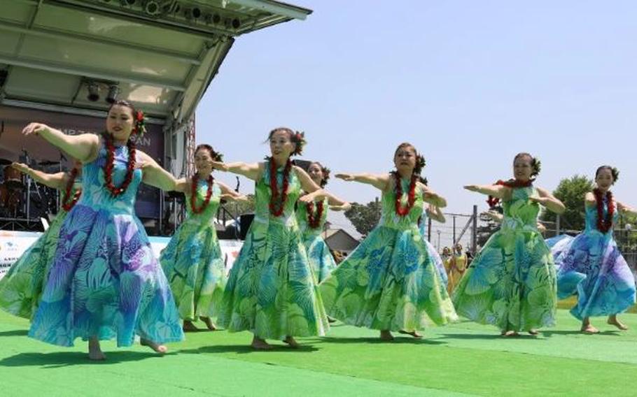 Local dancers perform a hula dance at the Hawaiian Festival April 28 on Sagami General Depot, Japan.