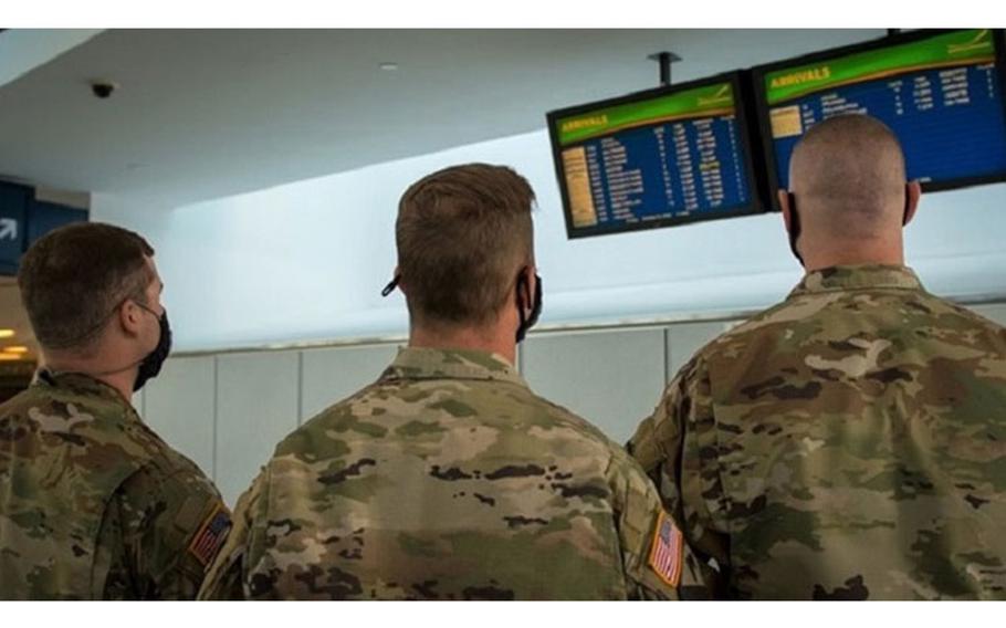 Soldiers assigned to 105th Military Police Company, Buffalo, New York, check the arrival boards at Buffalo-Niagara International Airport, supporting the state’s October travel advisory. The team meets arriving passengers to distribute the State Department of Health Traveler form to travelers coming from restricted states. (Air Force photo by Master Sgt. Brandy Fowler)