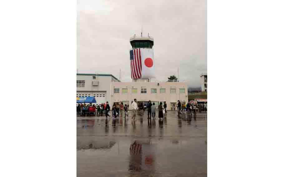 Festival attendees explore the flight line during the Fuji Friendship Festival on Combined Arms Training Center, Camp Fuji, Japan, Oct. 20, 2024. The festival is an annual event open to Status of Forces Agreement personnel and residents of Japan. The event featured musical performances from the III Marine Expeditionary Force Band, Omi, a Jamaican singer, food stands, and other forms of entertainment.
