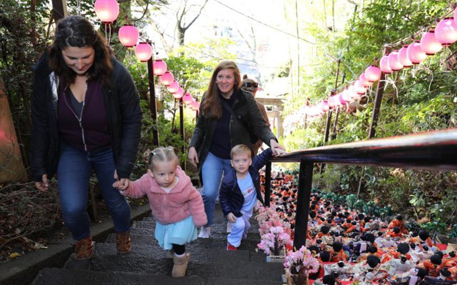 Keriann Creagh, left, and her daughter, Sloane, along with Caitlin Auten and her son, Harrison, admire the rows of dolls on display for the Dolls Festival, or “Hinamatsuri,” at the Zama Shrine in Japan, March 1, 2024. The Army Community Service at Camp Zama hosted a walking tour to the shrine for community members to enjoy the festival.