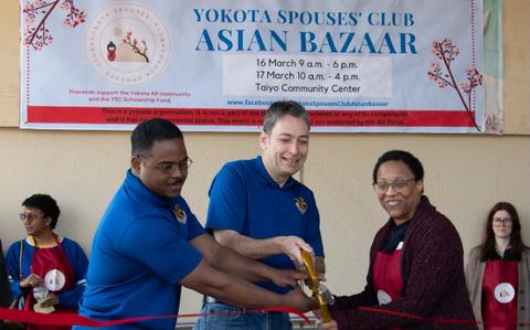 Photo Of From left, U.S. Air Force Chief Master Sgt. Jerry Dunn , 374th Airlift Wing command chief, Col. Andrew Roddan, 374th AWcommander, and Amber McClenney, Yokota Spouses’ Club (YSC) president, cut a ribbon, signifying the opening of the YSC Asian Bazaar at Yokota Air Base, Japan, March 16, 2024.