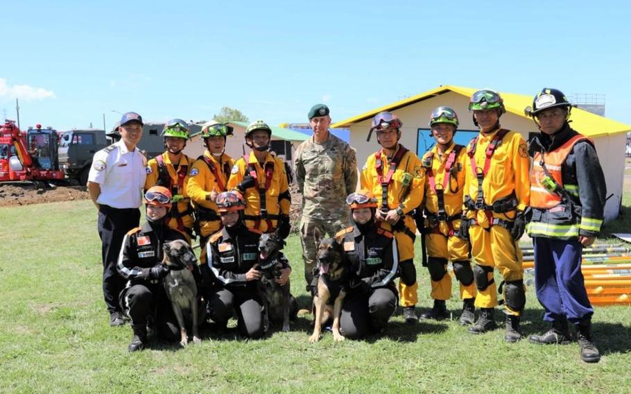 Col. Marcus Hunter, center, commander of U.S. Army Garrison Japan, and members of USAG Japan’s Directorate of Emergency Services team pose for a photo with other participants in the 44th Joint Disaster Drill of Nine Cities and Prefectures held Sept. in Sagamihara City, Japan, and the joint-use area at Sagami General Depot. Photo by Noriko Kudo