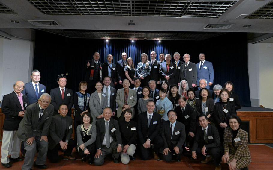 Airmen from the 374th Airlift Wing, along with members of local Friendship Clubs, pose for a group photo during the Yokota Friendship Clubs’ New Year’s Party at Yokota Air Base, Japan, Jan. 20, 2024. The first Yokota Friendship Club, named the Fussa-Yokota Goodwill Exchange Club, was established in 1989 as local Japanese community leaders wanted to express their appreciation to U.S. forces in Japan. (U.S. Air Force photo by Senior Airman Manuel Zamora)