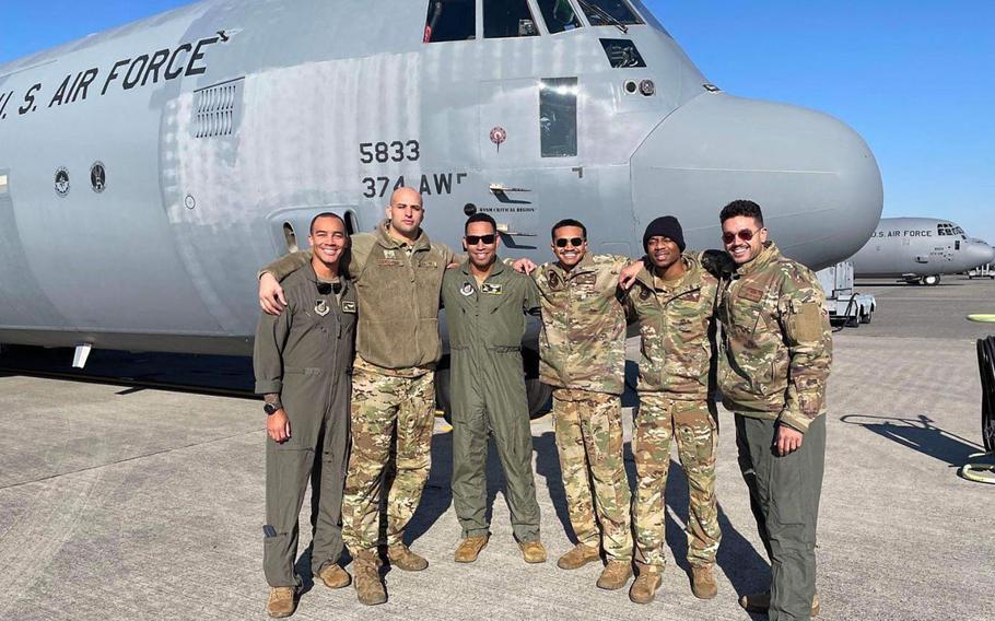 Members of the 36th Airlift Squadron stand together in front of a C-130J Super Hercules for a group photo, Feb. 6, 2023, at Yokota Air Base, Japan. This aircrew was made up of six members of the 36th AS, who participated in every aspect of the flight, from chalk to touch down. (Courtesy photo)