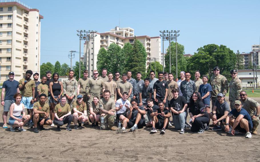 Airmen from the 374th Security Forces Squadron and Japan Air Self-Defense Force security members gather for a group photo following a "Battle of the Badges" competition in honor of Police Week at Yokota Air Base, Japan, May 17, 2023. The 374th Security Forces Squadron hosted the competition as part of a series of events to appreciate and commemorate peace officers who protect their publics with their lives. Photo by Senior Airman Brooklyn Golightly