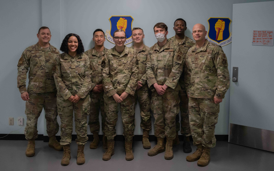 U.S. Air Force Col. Jesse J. Friedel (left), 35th Fighter Wing commander, and Chief Master Sgt. Joey R. Meininger (right), 35th FW command chief, stand with members of the 35th Logistics Readiness Squadron Installation Deployment Readiness Cell during a Wild Weasel Walk-through (WWWT) at Misawa Air Base, Japan, June 8, 2022. As Friedel and Mieninger’s last WWWT, they visited the IDRC to bid farewell and offer them words of encouragement. (U.S. Air Force photo by Joao Marcus Costa)