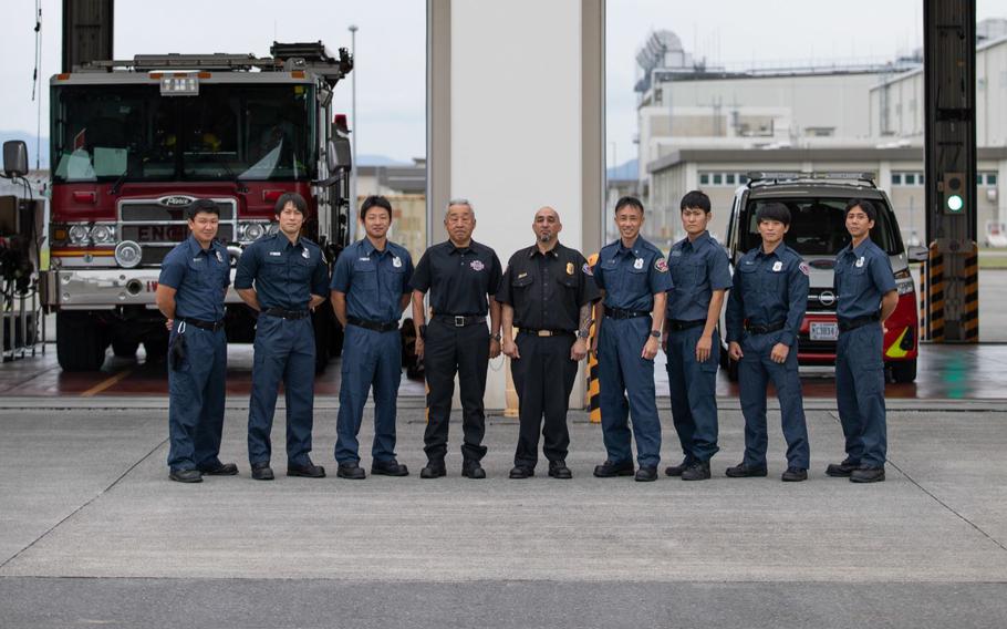 Members of the Marine Corps Air Station Iwakuni Fire Department pose for a group photo in front of Fire Station 1 at MCAS Iwakuni, Japan, Sept. 29, 2022. The fire department safeguards property and personnel from emergency situations by providing all-hazard response services. To increase the community’s knowledge on fire prevention and education, the fire station hosts open houses and teaches classes throughout the year. (photo by Sgt. Phuchung Nguyen)