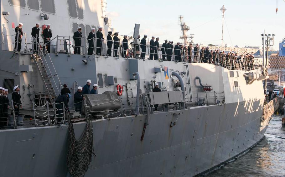 Sailors aboard the Arleigh Burke-class guided-missile destroyer USS Shoup (DDG 86) moor the ship as it arrives at Commander, Fleet Activities Yokosuka (CFAY) as the newest addition to Commander, Task Force (CTF) 71/Destroyer Squadron (DESRON) 15. CF 71/DESRON 15, is the Navy's largest forward-deployed DESRON and the U.S, 7th Fleet's principal surface force. (U.S. Navy photo by Mass Communication Specialist 2nd Class Zachary Grooman)