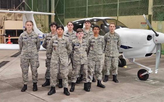 Photo Of Misawa Cadet Squadron cadets stand in front of a DA-40 plane they flew prior that day!