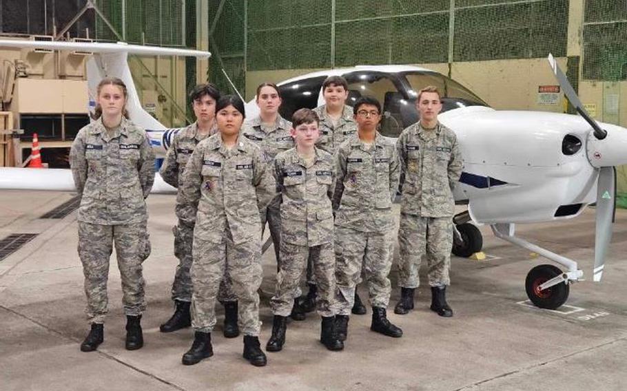 Misawa Cadet Squadron cadets stand in front of a DA-40 plane they flew prior that day!