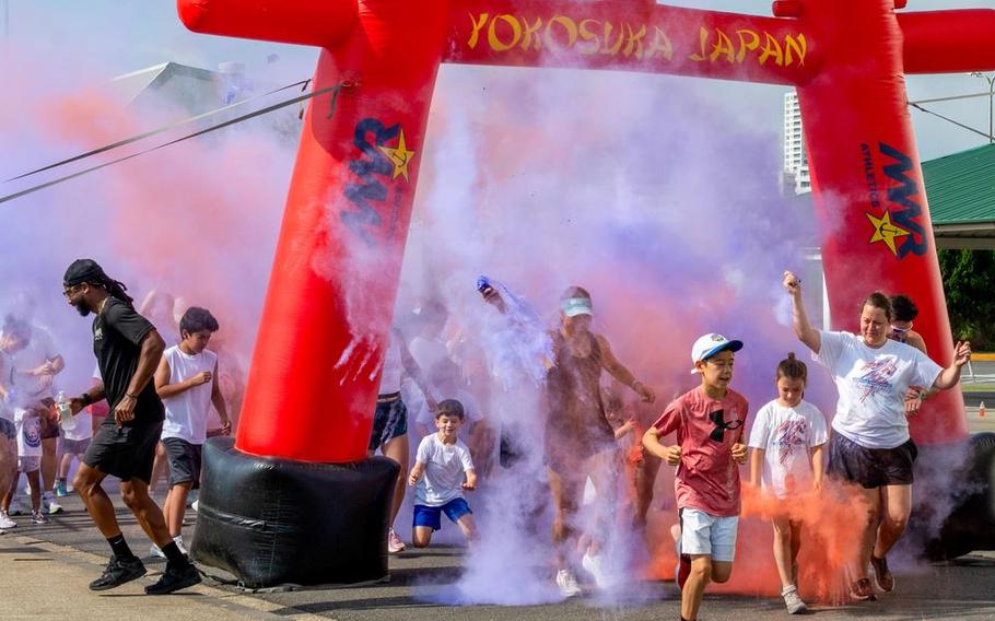Commander Fleet Activities, Yokosuka families participate in a 4th of July color run. This fun run kicks off a number of special Independence Day events hosted by CFAY MWR.