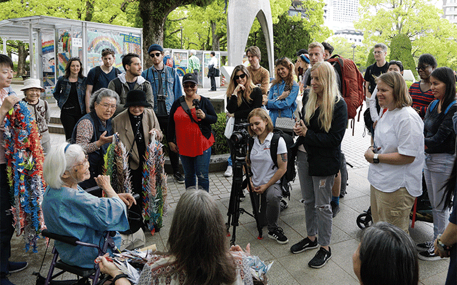 Marine Corps Air Station Iwakuni residents and Japanese residents ask Kikuko Shinjo, a survivor of the atomic bombing in Hiroshima during World War II, questions in Hiroshima, Japan, April 26, 2019. Shinjo makes 1,000 paper cranes as a wish for continued peace in the region. The visit was coordinated by the Cultural Adaptation Program to help strengthen the positive relationship between the U.S. and Japan. (U.S. Marine Corps photo by Pfc. Triton Lai)