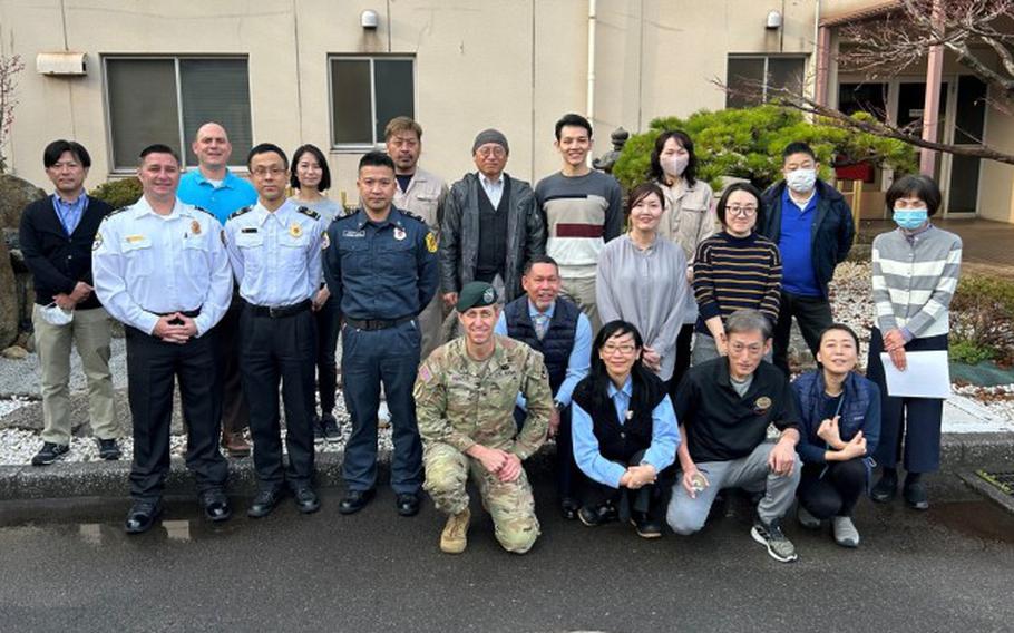 Col. Marcus Hunter, center, U.S. Army Garrison Japan commander, poses with members of the garrison team at Kure Pier 6 during a recent two-day trip to the Kure Ammunition District in Hiroshima, Japan.