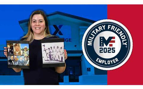 Photo Of a woman holding pictures of service members