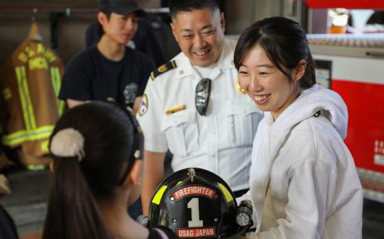 Photo Of Yui Kajita receives an in-depth look of her father’s workplace at Fire Station 1 during the “Bring Your Kids to Work Day” event.