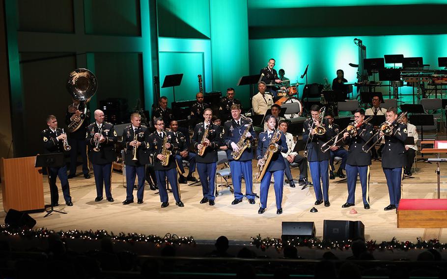 The U.S. Army Japan Band performs during a holiday concert, titled “An American Holiday Festival,” Dec. 17 at Zama Harmony Hall in Zama City, Japan. This year marked the return of an annual collaborative holiday concert, the first to be held at the venue since 2019 due to its cancellation last year because of COVID-19. (Photos by Noriko Kudo)