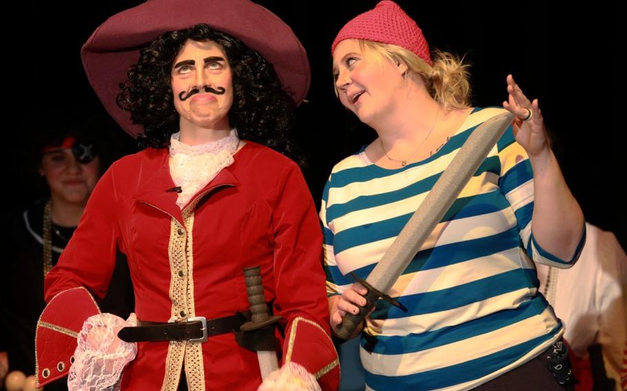 Brook Colgan, left, as Captain Hook, and Lauren Zmyewski, right, as the pirate Smee, act out a scene during a dress rehearsal May 16 at the Community Recreation Center on Camp Zama, Japan, for the Zama Community Theater Group’s staging of the musical version of “Peter Pan.” The newly revived group staged its first show since 2019, holding three nights of performances May 19 through 21. (Dustin Perry, U.S. Army Garrison Japan Public Affairs)