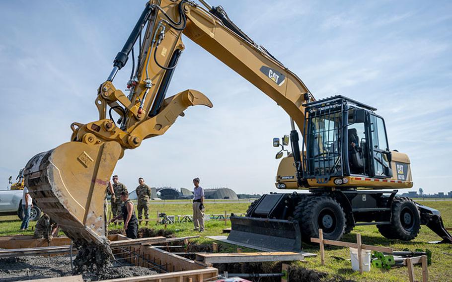 A Japanese contractor operates an excavator while constructing a mobile aircraft arresting system (MAAS) and mobile runway edge sheave (MRES) on taxiway bravo at Misawa Air Base, Japan, July 24, 2023. The MAAS/MRES systems recover or launch aircraft when traditional means won’t work, such as faulty brakes. (U.S. Air Force photo by Senior Airman Antwain Hanks)