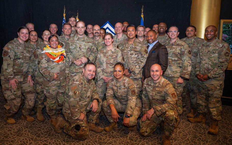 U.S. Air Force chief master sergeants and selects pose for a photo during the chief master sergeant release party at Yokota Air Base, Japan.