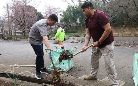 Photo Of Soldiers assigned to the 5th Transportation Company, 765th Transportation (Terminal) Battalion, clean out drainage ditches during a joint cleanup effort.