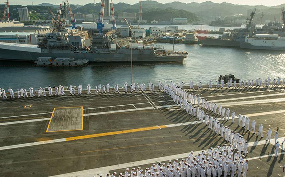 Sailors man the rails aboard the U.S. Navy’s only forward-deployed aircraft carrier, USS Ronald Reagan (CVN 76), as the ship departs Commander, Fleet Activities Yokosuka, Sept. 12. Ronald Reagan, the flagship of Carrier Strike Group 5, provides a combat-ready force that protects and defends the United States, and supports alliances, partnerships and collective maritime interests in the Indo-Pacific region. (U.S. Navy photo by Mass Communication Specialist Seaman Natasha ChevalierLosada)