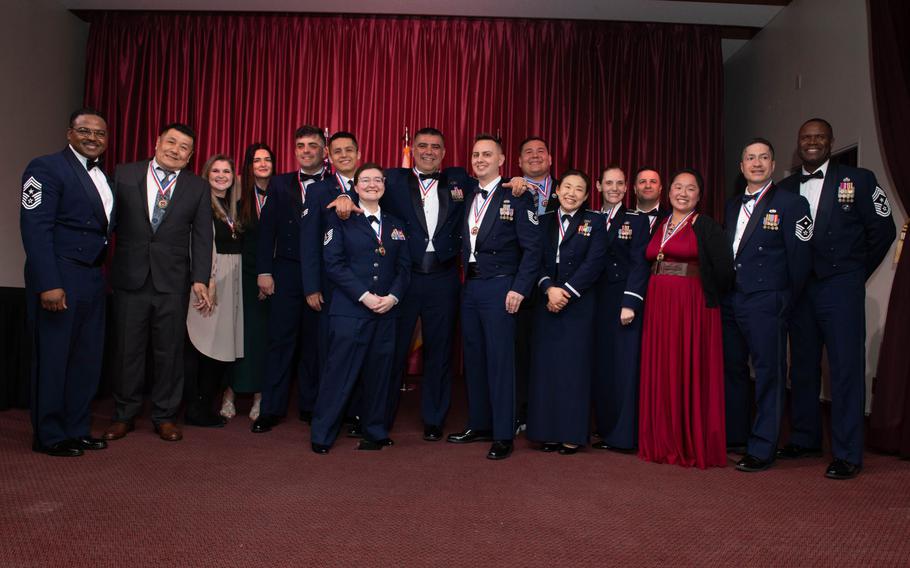 Members of the 374th Airlift Wing pose for a group photo during the 374th AW 2023 Annual Awards Ceremony at Yokota Air Base, Japan, March 1, 2024. Nineteen personnel were selected across multiple groups, detachments and sections and will move on to compete for Pacific Air Forces Annual Awards.