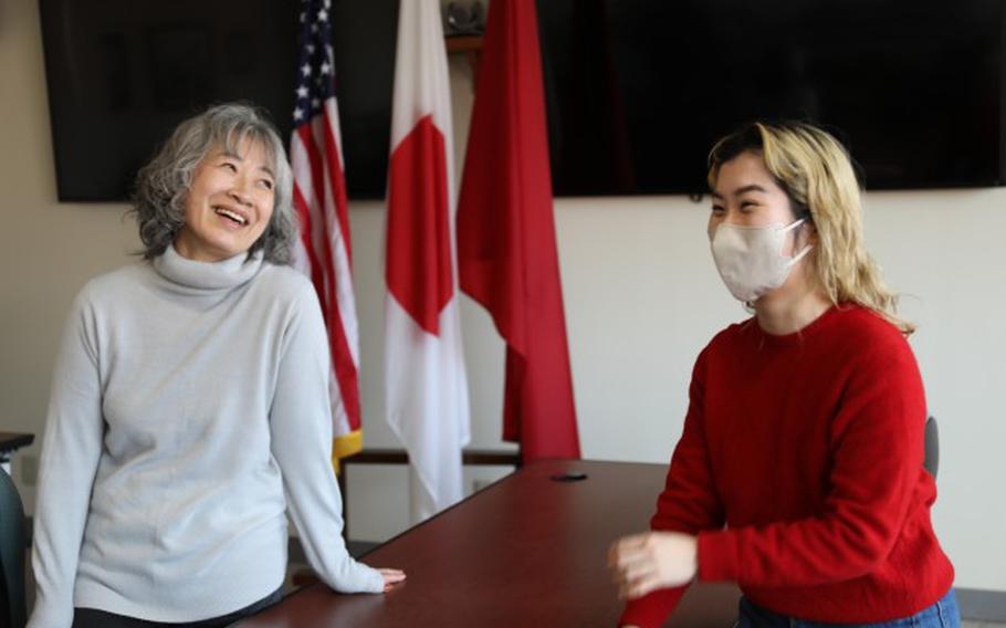 Nagisa Ishikawa, right, an administrative specialist assigned to the Engineer Device branch at the Directorate of Public Works, talks with her co-worker and mentor, Naoko Koh, about Ishikawa’s intern days during a chat Feb. 2. Ishikawa participated in Camp Zama’s college intern program in 2017 and returned to work as a full-time employee. (Noriko Kudo)