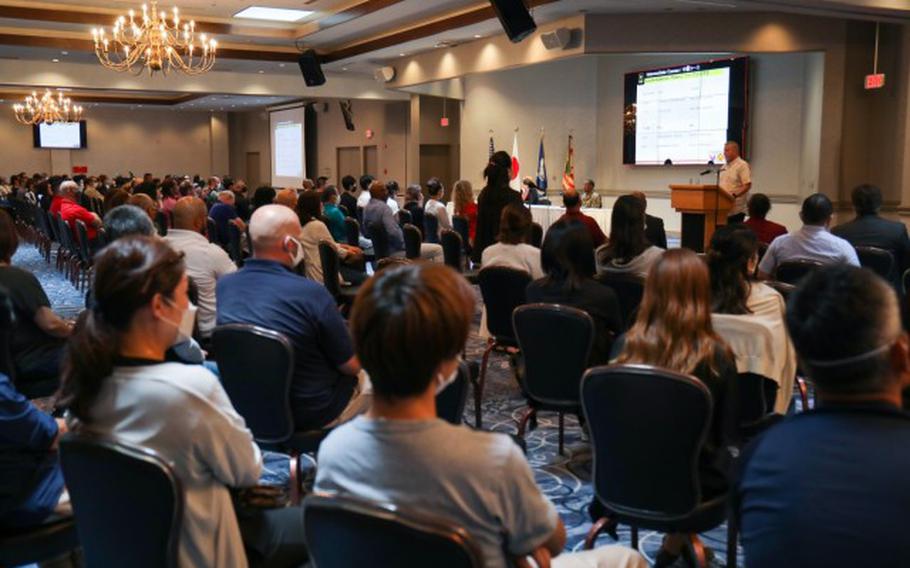 Nearly 300 employees attended a town hall virtually or in-person at the Camp Zama Community Club, Japan, Aug. 19, 2022. Leadership addressed concerns and shared updates on programs and services available to the workforce during the meeting. (Photo Credit: Sean Kimmons)