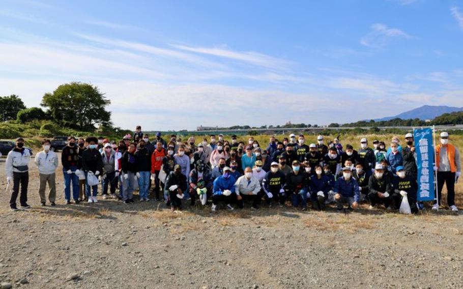 Volunteers pose for a group photo at an off-post community cleanup Oct. 30, 2022, at the Sagamihara City Shindo Sports Ground near Camp Zama, Japan. About 40 volunteers from Camp Zama joined Sagamihara City, Zama City, and Japan Ground Self-Defense Force volunteers for the joint cleanup. (Photo Credit: Tim Flack)