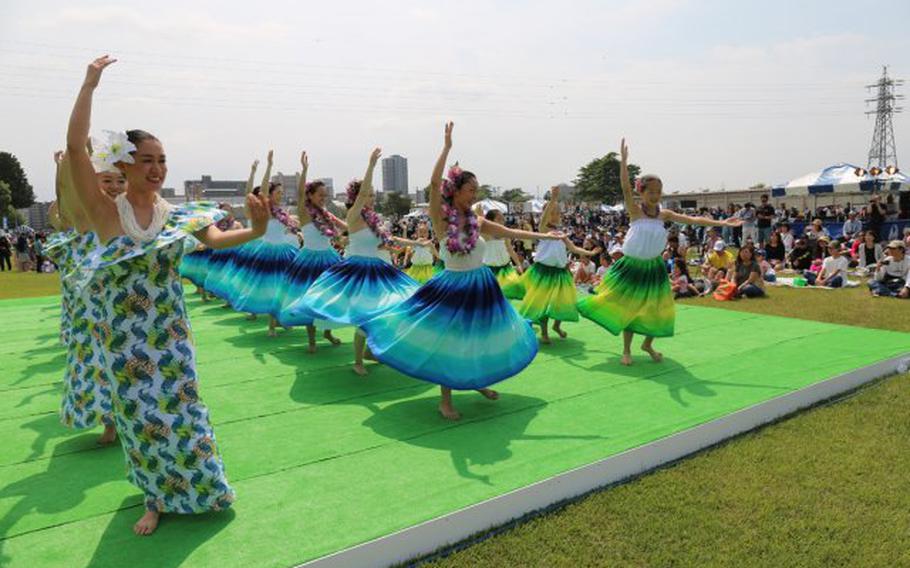 Hula dancers perform in front of the crowd at the Hawaiian Festival May 12 on Sagami General Depot, which Camp Zama's Family, Morale, Welfare and Recreation hosted. The open-post event drew more than 9,000 visitors. (Photo Credit: Noriko Kudo, U.S. Army Garrison Japan Public Affairs)