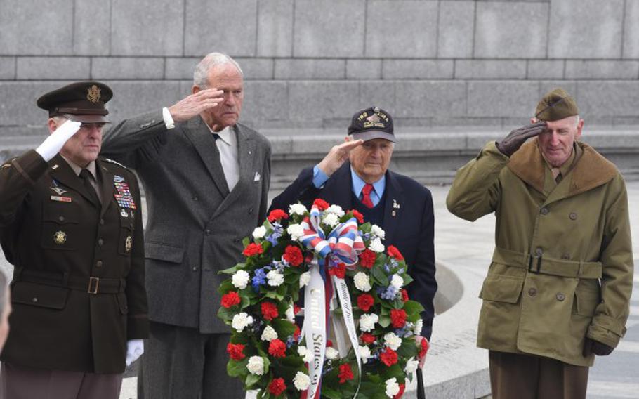 From left: Army Gen. Mark A. Milley, chairman of the Joint Chiefs of Staff; Josiah Bunting III, chairman, Friends of the National World War II Memorial; Ira Rigger, a veteran of the battle of Iwo Jima and other campaigns; and, Harry Miller, a World War II, Korean War and Vietnam War veteran, lay a wreath commemorating the 75th anniversary of the start of the battle of Iwo Jima at the National World War II Memorial in Washington, Feb. 19, 2020. (Photo Credit: David Vergun, DOD)