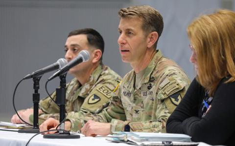 Photo Of Col. Marcus Hunter, center, commander of U.S. Army Garrison Japan, answers a question during a housing town hall inside Kizuna Hall at Camp Zama, Japan, March 7, 2024.