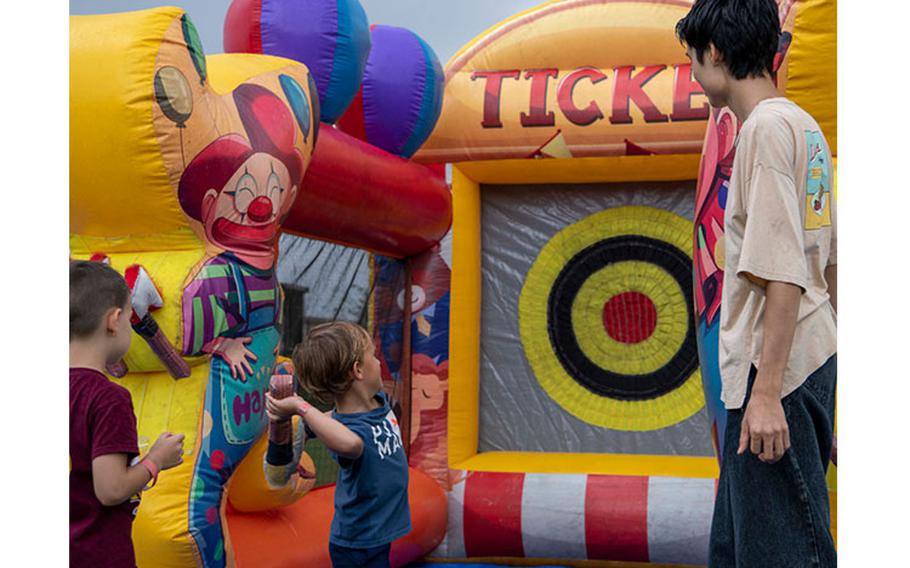 Members of the Yokota community play a carnival game during the annual ‘Eventageous’ fall festival at Yokota Air Base, Japan, Sept. 23, 2023. Attendees were able to enjoy a variety of free carnival games for a chance to win prizes. (U.S. Air Force photo by Airman 1st Class Samantha White)