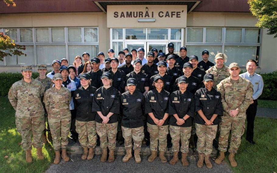Samurai Cafe team members pose for a photo in front of the dining facility on Yokota Air Base, Japan.