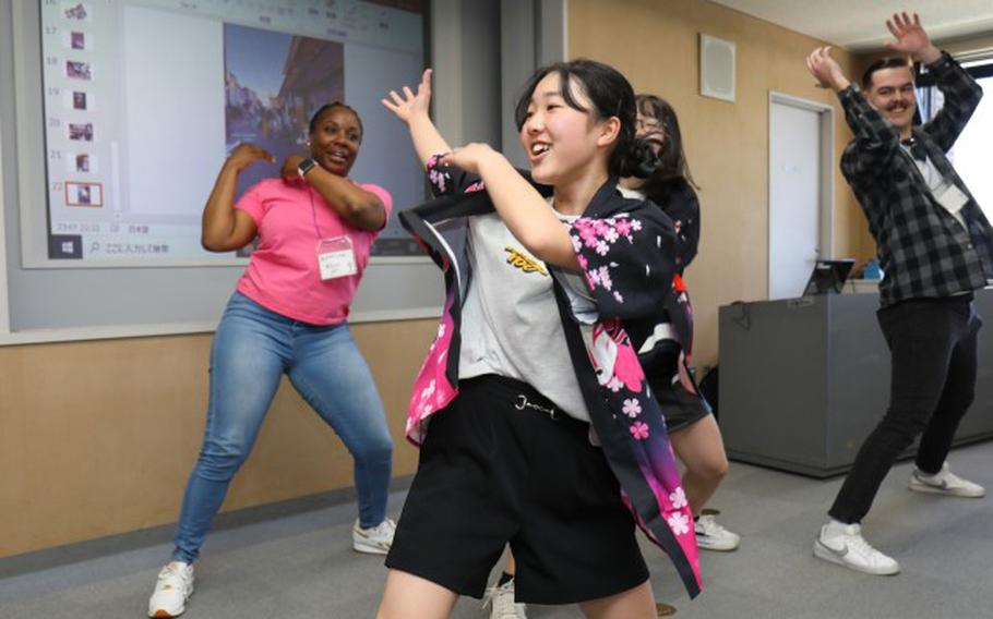 Waka Ishiguro, front, teaches the “soran bushi” performance to Camp Zama volunteers during a language and cultural event at Zama City Hall, Japan, May 3, 2024.