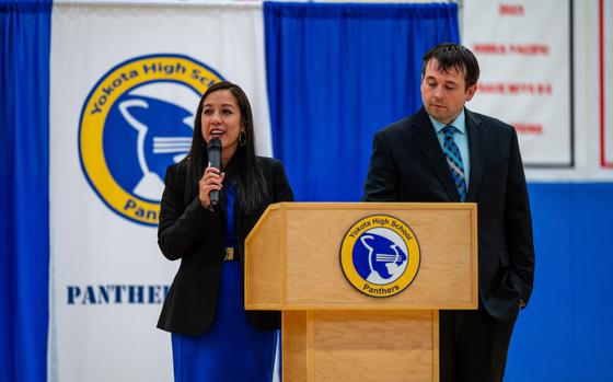 Photo Of Dr. Rebecca Villagomez, left, Yokota High School principal, addresses students at an assembly to mark the start of the new academic year at YHS on Yokota Air Base, Japan, Aug. 19, 2024.