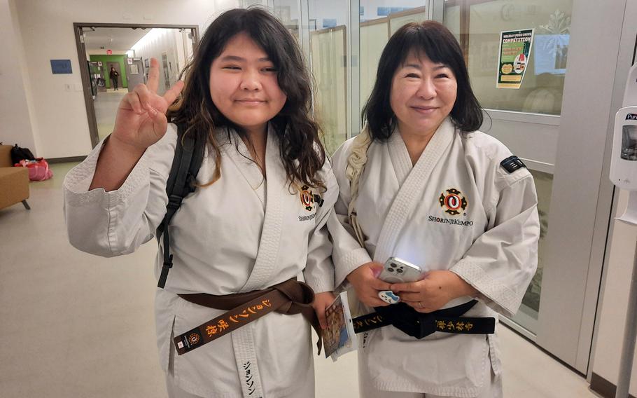 Eighth-grader Sakura Johnson and her mother, Dr. Hisae Johnson, pose between kenpo demonstrations at Edgren Middle High School on Misawa Air Base, Japan, Dec. 6, 2024. 