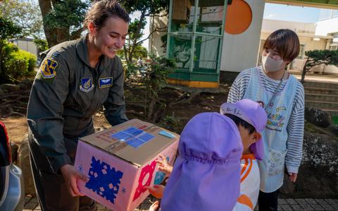 Photo Of U.S. Air Force Capt. Miranda Bapty, 36th Airlift Squadron C-130J Super Hercules pilot, receives a donation from a kindergarten student in Shizuoka, Japan, Oct. 15, 2024.