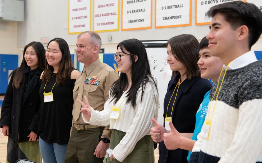 Brig. Gen. James Wellons, U.S. Forces Japan deputy commander, joins U.S. and Japanese students for a group photo during a Youth Exchange Program workshop, March 5, 2023, at Yokota Air Base, Japan. The exchange included students from Yokota Air Base and local Japanese schools, who worked on collaborative projects meant to promote mutual understanding and build problem-solving skills. (U.S. Air Force photo by 1st Lt. Danny Rangel)