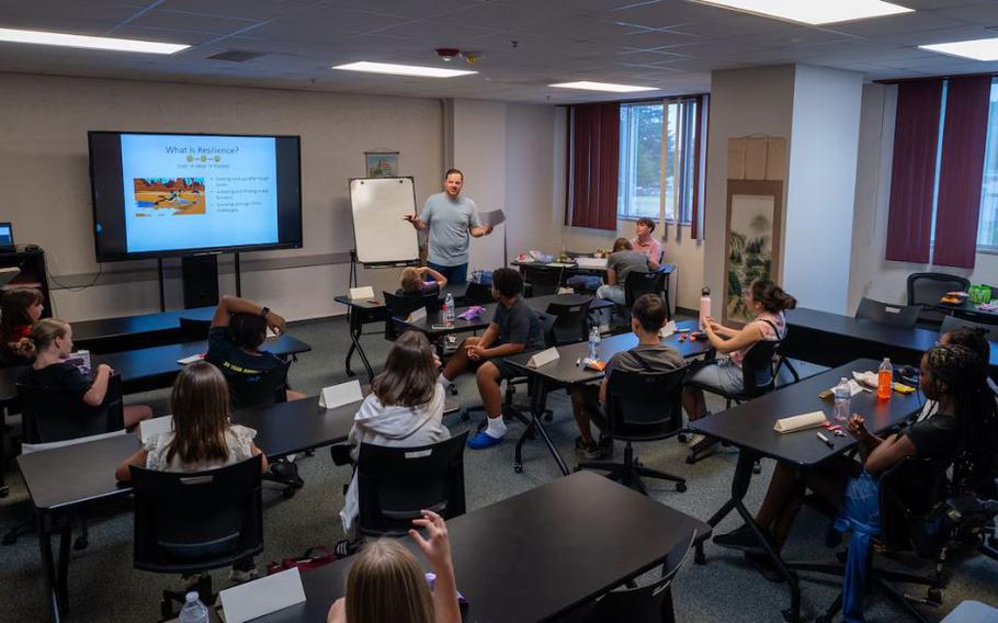 Joshua Fly, 374th Airlift Wing school liaison program manager, leads a lesson on different types of leadership for students attending the Student Ambassador Training Program at the Military and Family Readiness Center.