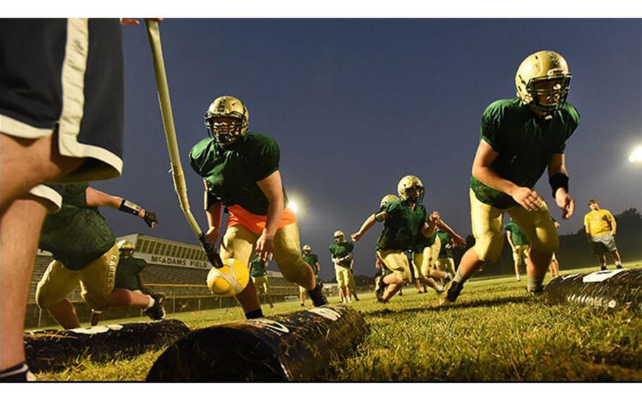 Linemen from the Fort Knox Eagles football team practice reaction drills in August 2021, learning to anticipate moving when the ball moves (Photo by: Eric Pilgrim, Fort Knox).