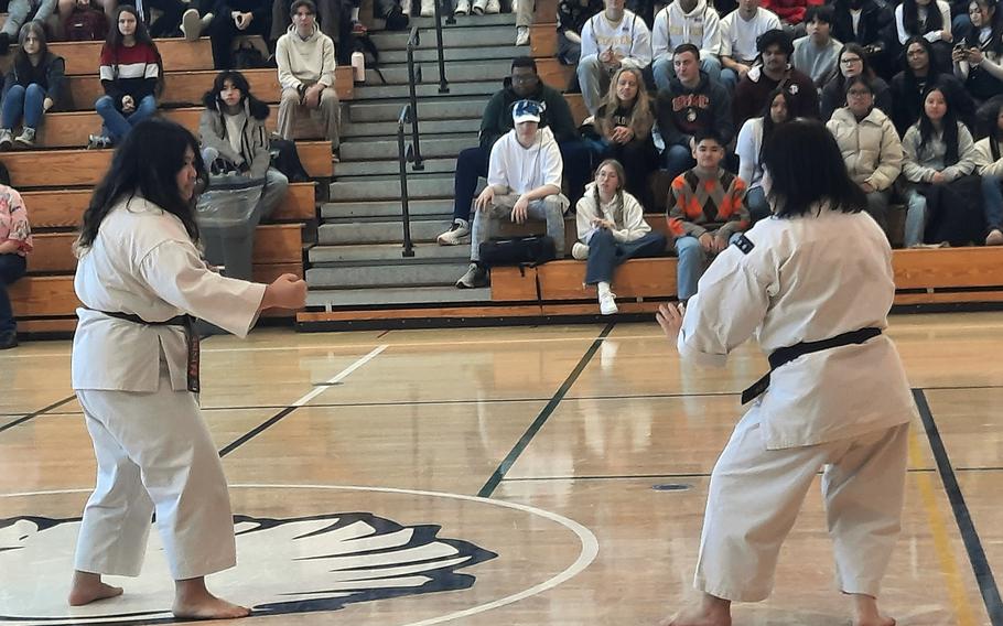 Eighth-grader Sakura Johnson and her mother, Dr. Hisae Johnson, conduct a kenpo demonstration at Edgren Middle High School.